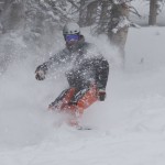 Colorado Snowboarder Photograph Shannan Osburn enjoys snowboarding the fresh powder during AVSC day at Aspen Mountain.